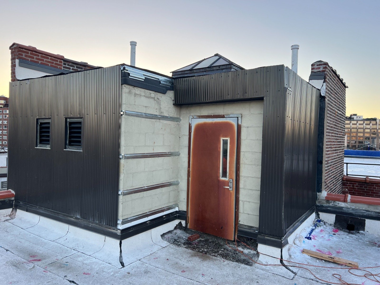 Roofing contractor working on NYC Bronx building